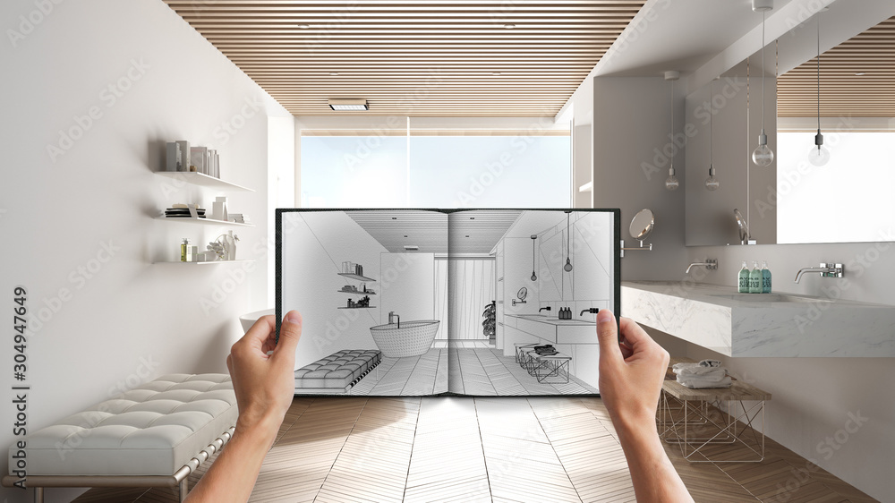 Hands holding notepad with creative bathroom design blueprint sketch or ...