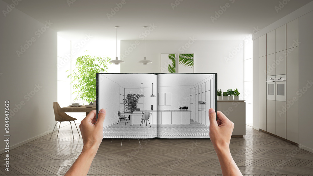Hands holding notepad with creative kitchen design blueprint sketch or ...