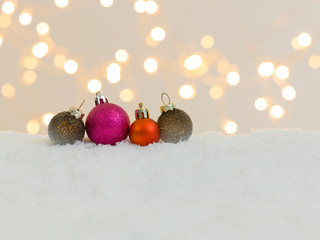 Wall Mural - many different christmas items on white snow with many small, shining lights in the background