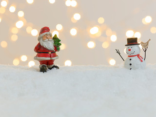 Wall Mural - many different christmas items on white snow with many small, shining lights in the background