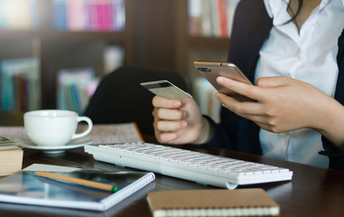 Wall Mural - Businesswoman using mobile phone to payment or shopping online with credit card