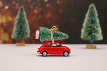 Little Red Car Driving Christmas Tree On The Roof 