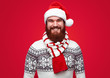 © kegfire - Happy man in Santa hat and scarf