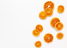  Christmas Composition With Dried Oranges Slices On White Background. Natural Dry Food Ingredient For Cooking Or Christmas Decor For Home. Flat Lay.