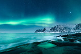 Fototapeta Na sufit - Magical Northern Lights Aurora in starry night on Lofoten Islands in Norway. Amazing winter landscape.