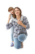 © Pixel-Shot - Portrait of happy mother and daughter on white background