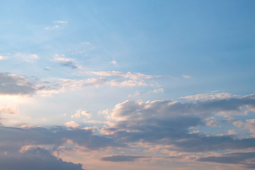 Evening light with clouds and blue sky.