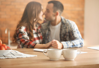 Sticker - Beautiful young couple having breakfast at home