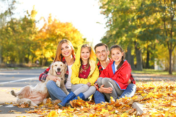 Canvas Print - Portrait of happy family in autumn park