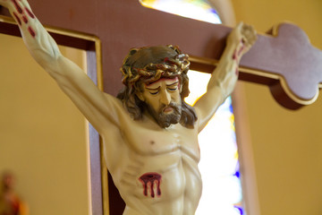 Wall Mural - Zegiestow, Poland. 2019/8/10. Jesus Christ on the Cross. Roman Catholic Church of Saint Anne (formerly Byzantine church of Saint Michael the Archangel ).