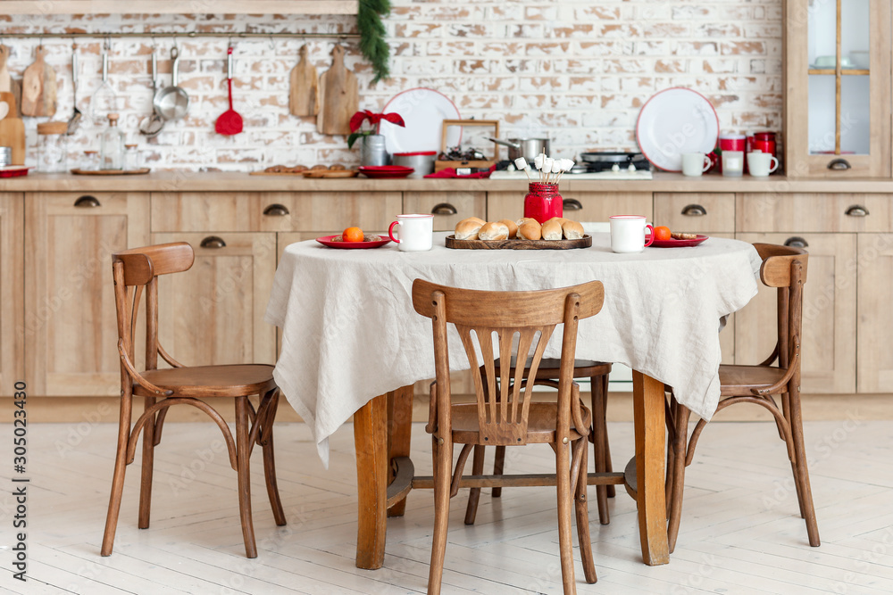 Interior of stylish kitchen with served table