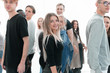 © ASDF - casual young woman standing among diverse young people.