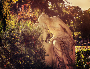 Funerary neo-classical monument: tearful nymph grieving on a grave