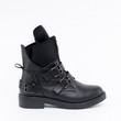 Stylish winter black leather womens boots with laces and buckles. On white background. See other angles of this boot and other models in my profile