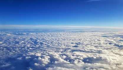 a landscape above the clouds