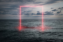 View Of The Calm Sea In The Evening, A Neon Frame Emerging From The Water, Futuristic Background