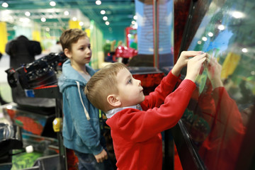Child plays game on touchscreen