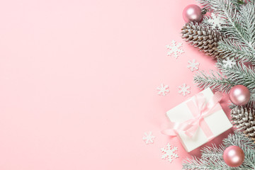 Christmas flat lay background with christmas present box on pink.