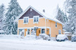 yellow house in snow