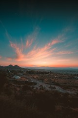 Wall Mural - Vertical shot of the street under the beautiful colorful sky captured in Andalucia, Spain