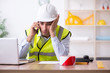 © Elnur - Young male architect working in the office