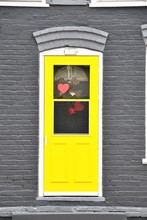 Yellow Door On Gray Wall