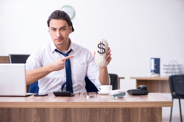 Young male businessman working in the office