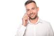 © Igor - smiling businessman talking on smartphone isolated on white