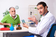 © Elnur - Old man visiting young male doctor gastroenterologist