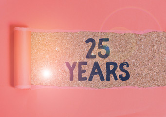 Wall Mural - Text sign showing 25 Years. Business photo text Remembering or honoring special day for being 25 years in existence Cardboard which is torn in the middle placed above a wooden classic table