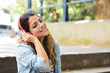 © Mego-studio - Young woman listening to music with headphones.