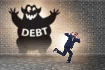 Businessman in debt and loan concept