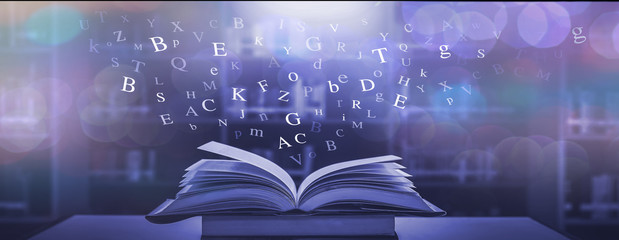 Imagine opening an old book blurred with magic power on the table and the English alphabet floating above the book with magic light as a beautiful background design.