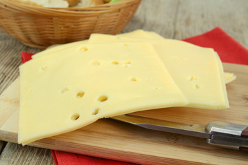 slice of gruyere on a cutting board