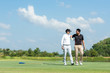 © freebird7977 - Group Professional Golfer asian man walking and hug for friendship after finish put ball on green. Hobby in holiday and vacation with friends.  Lifestyle and Sport Concept