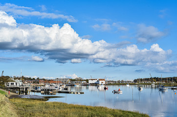 Woodbridge harbour with boats sitting in the river