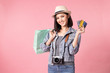 © anon - Tourist woman in summer casual clothes.Asian Smiling woman .Passenger traveling abroad to travel on pink background.She going to summer vacation.Travel trip funny Credit card on holiday.