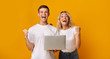 © Prostock-studio - Overjoyed young guy and girl celebrating win with laptop