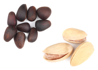 Wall Mural - Cashews and pine nuts isolated on white background.