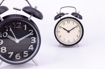 Alarm clock on white background. Selective focus.