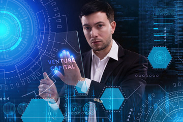 business, technology, internet and network concept. young businessman working on a virtual screen of