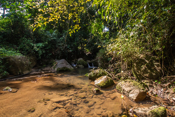 Kathu Waterfall in the tropical forest area In Asia, suitable for walks, nature walks and hiking, adventure photography Of the national park Phuket Thailand,Suitable for travel and leisure.