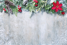 Christmas And New Year Background With Fir Branches And Snowfall On Wooden White Board