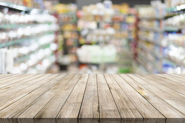 Wall Mural - Natural wooden desk on blur bokeh mall background