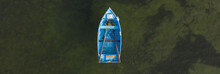 Blue Rowing Boat Top Down Aerial With Ocean Background