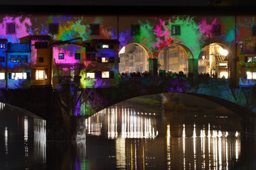 Wall Mural - Italy, Florence, December 2018: The Famous Old Bridge (Ponte Vecchio) of Florence, illuminated on the occasion of the F-Light, Festival of Lights, during the Christmas Season 2018. Italy