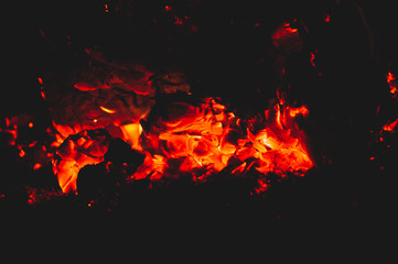 Imadge of hot coals on black background. Close-up.