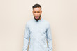 © Asier - Young south-asian business man screaming very angry and aggressive.