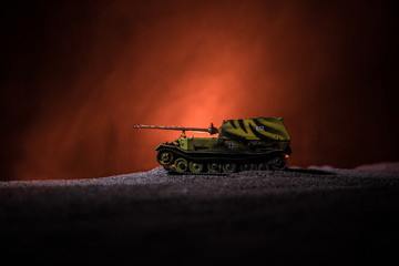 War Concept. Military silhouettes fighting scene on war fog sky background, Silhouette of armored vehicle below Cloudy Skyline At night. Attack scene. Tanks battle.