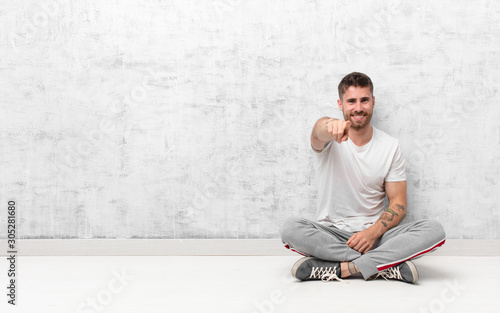 Cuadros en Lienzo young handosme man pointing at camera with a satisfied, confident, friendly smil